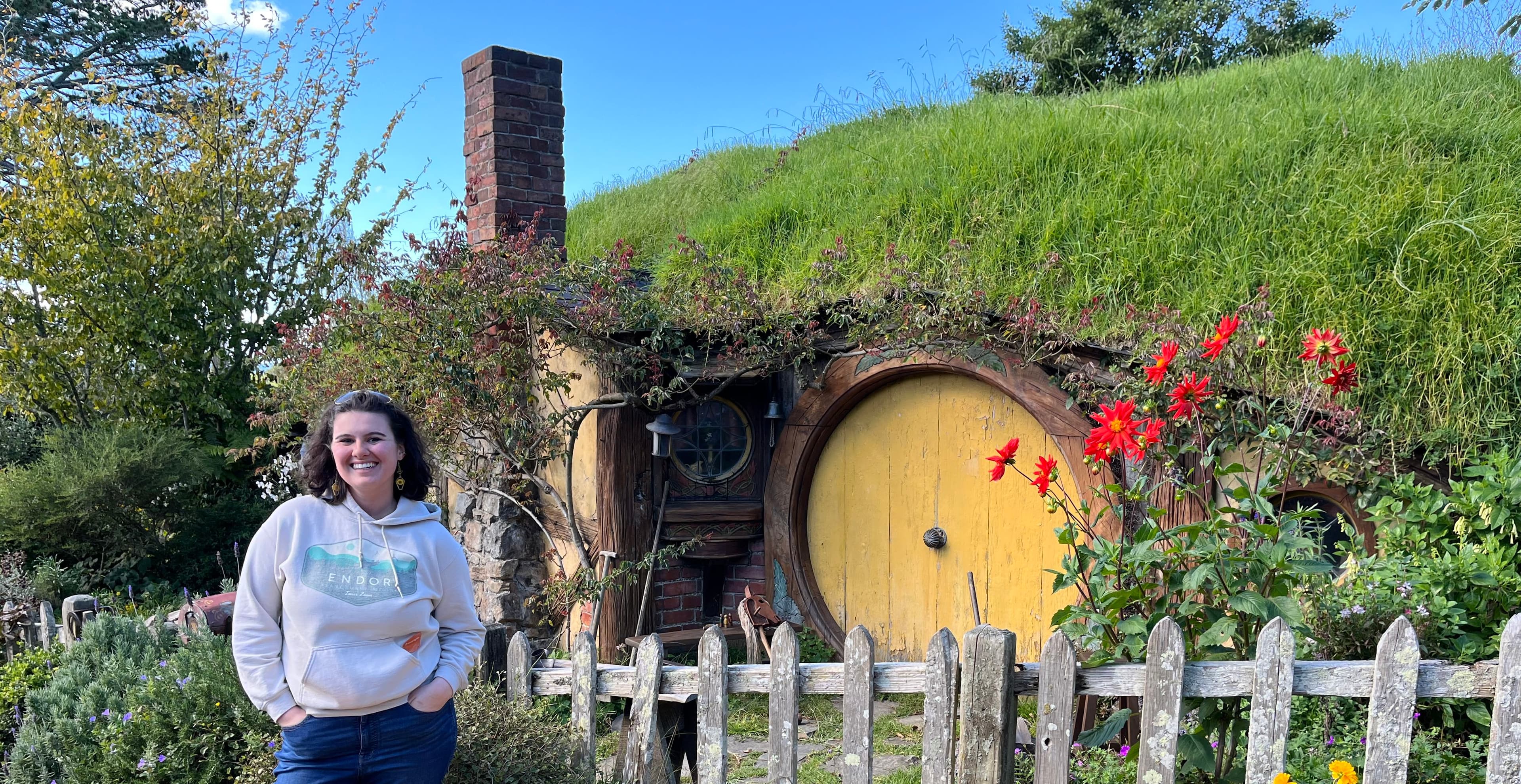 Selena standing in front of a Hobbit hole